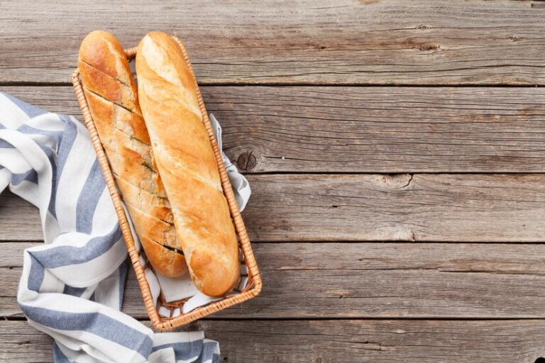 A freshly baked authentic French baguette with a golden crust, ready to be enjoyed.