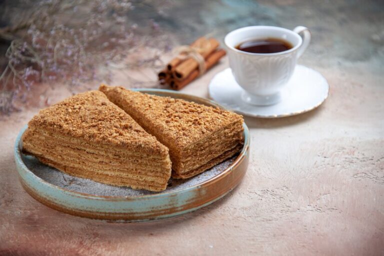 Indulge in the irresistible layers of traditional Bolo de Bolacha – a no-bake Portuguese biscuit cake that’s creamy, coffee-infused, and absolutely delicious!