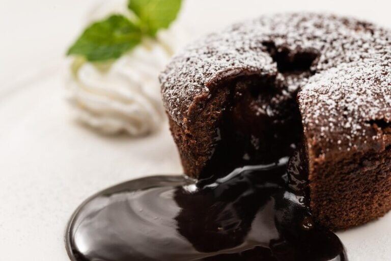 Indulge in the rich and gooey goodness of this classic American chocolate lava cake with a molten center, served warm with vanilla ice cream or whipped cream!