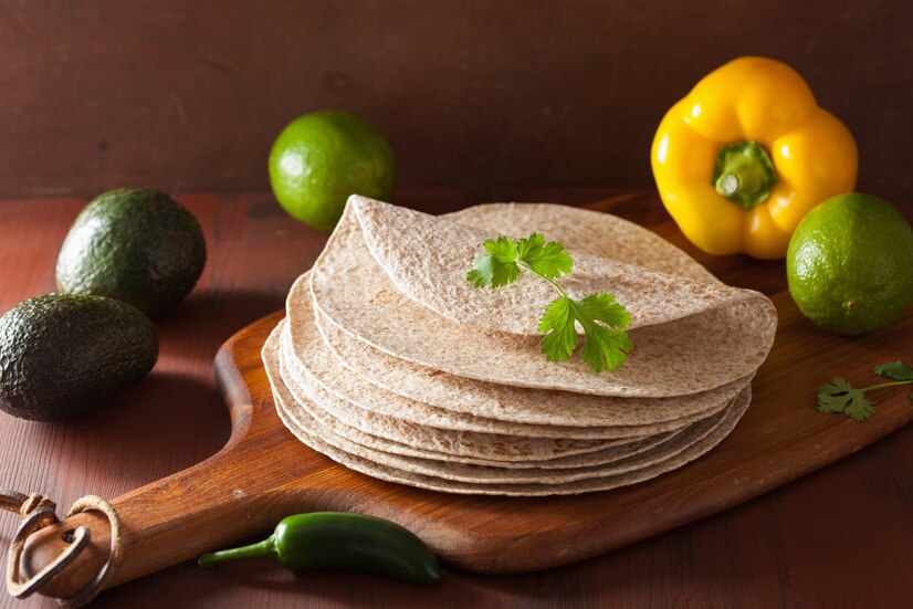 Freshly made tortillas, both corn and flour, ready to be filled with delicious ingredients for tacos, burritos, and quesadillas.